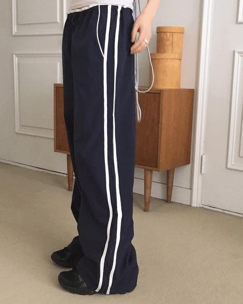 レーニンサイドストラップトラックナイロンパンツ